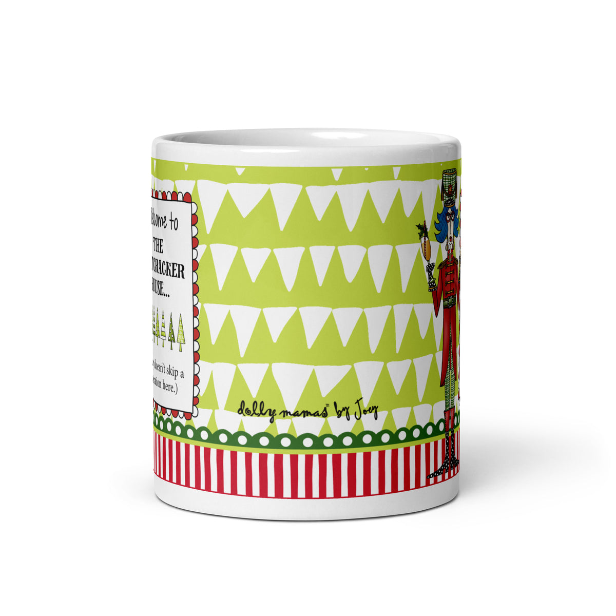 Wraparound view of the Dolly Mama Nutcracker House mug showing a lime-green and white triangle pattern, Joey’s signature, and red-and-white stripes.
