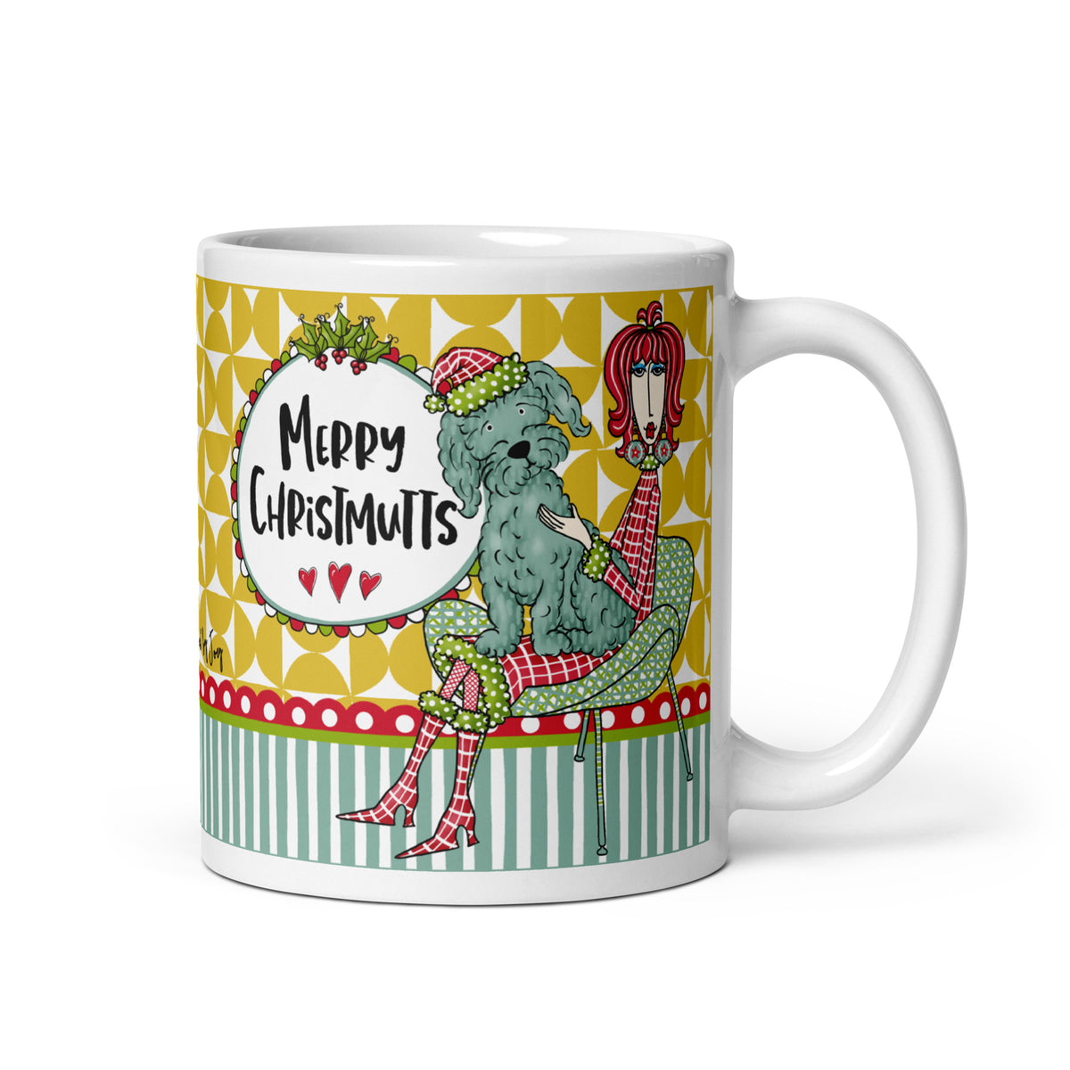
Dolly Mama “Merry Chrismutts” 11 oz mug featuring a seated woman with a shaggy dog wearing a Santa hat, and handle right.
