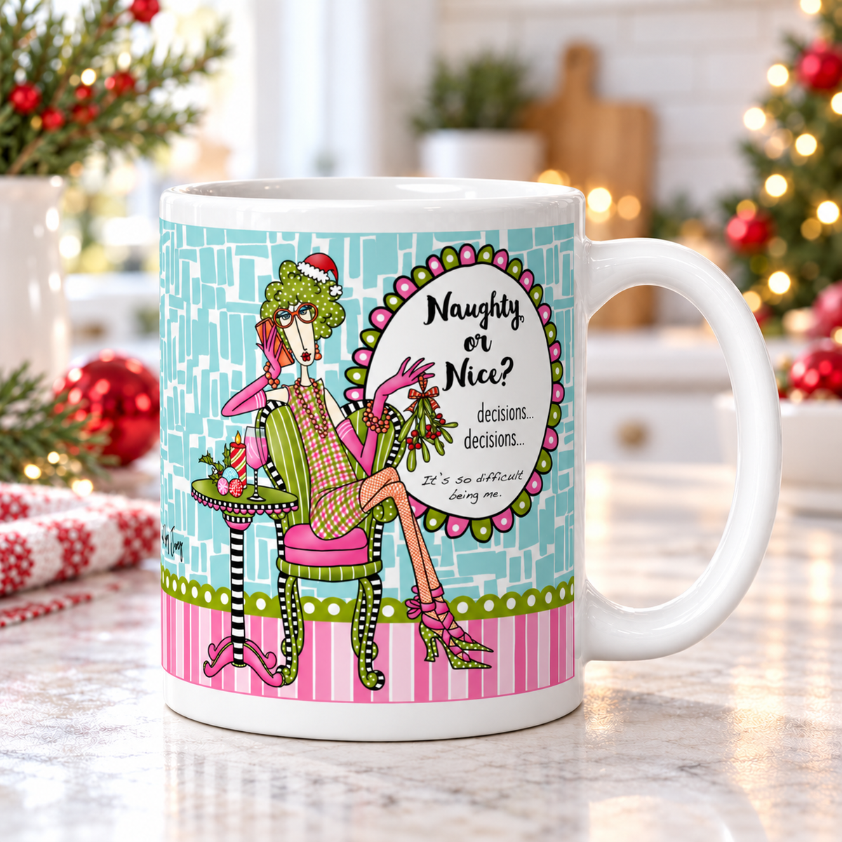 
Dolly Mama “Naughty or Nice?” mug on a bright kitchen counter, handle right, with Christmas greenery and red ornaments.
