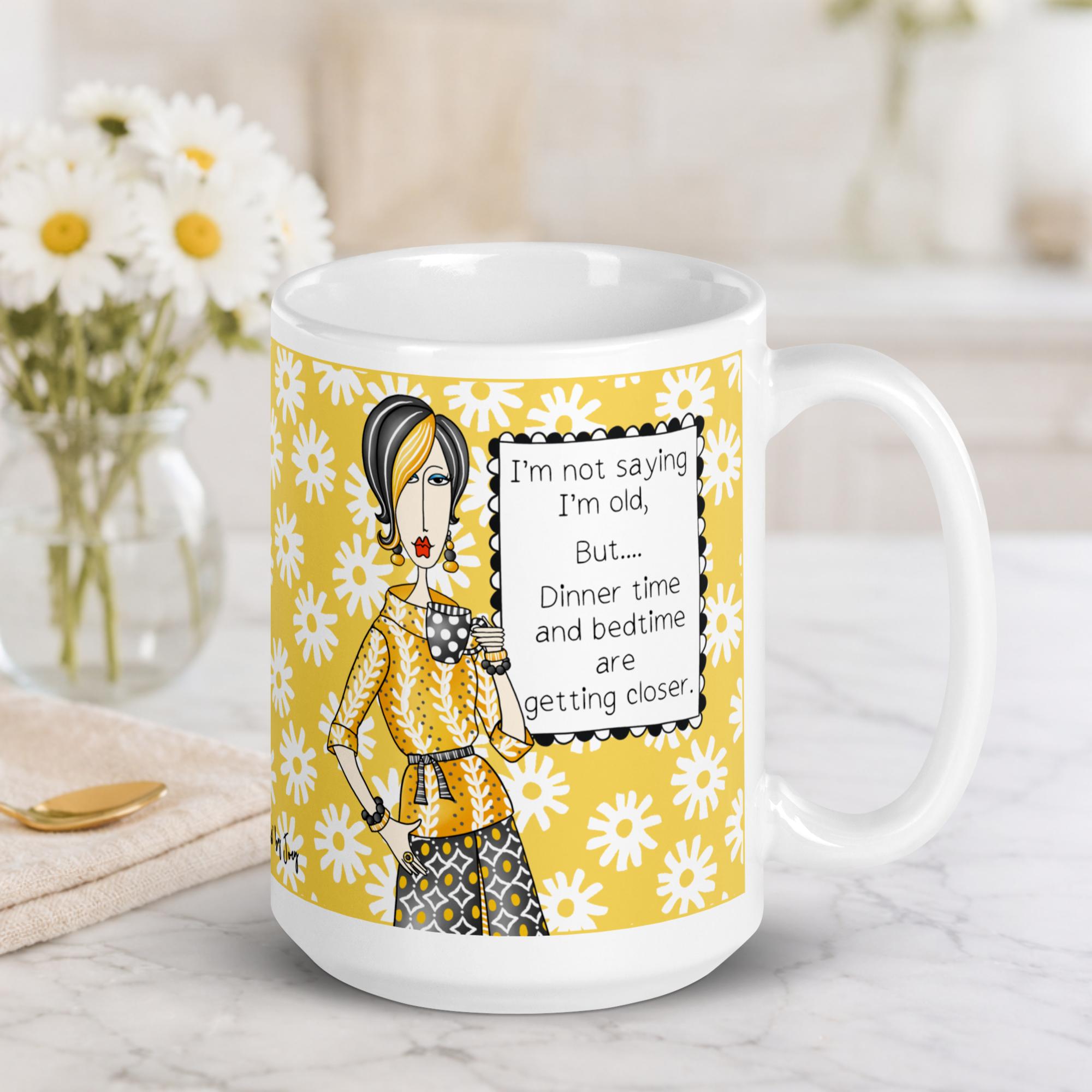 "Funny aging humor coffee mug – 'I'm not saying I'm old, but dinner time and bedtime are getting closer' – ceramic gift mug for women and midlife humor"
